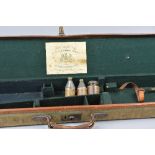 A CANVAS RIFLE CASE COMPLETE WITH TRADE LABEL FOR JOHN RIGBY & CO, 43 Sackville Street, Nos