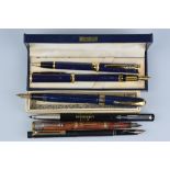 A BOXED CONWAY STEWART 27 FOUNTAIN PEN, in machined blue and gold finish, a Sheaffer slimline