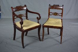 A SET OF ELEVEN REGENCY MAHOGANY ROSEWOOD AND BRASS INLAID DINING CHAIRS, moulded top rail above bar
