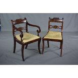 A SET OF ELEVEN REGENCY MAHOGANY ROSEWOOD AND BRASS INLAID DINING CHAIRS, moulded top rail above bar