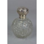 A LATE VICTORIAN/EDWARDIAN CUT GLASS SPHERICAL SCENT BOTTLE, hinged repousse decorated cover