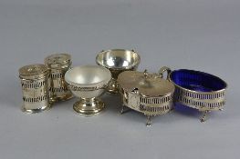 A GEORGE V ADAM STYLE FOUR PIECE SILVER CRUET SET, of oval form, comprising a pair of pepperettes, a