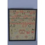 A 19TH CENTURY NEEDLEWORK SAMPLER, cotton on a coarse linen ground, with alphabets, numbers,