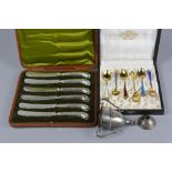 A CASED SET OF SIX 20TH CENTURY NORWEGIAN GILT STERLING AND ENAMEL HARLEQUIN COFFEE SPOONS,