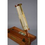 A CASED STANLEY FULLER CALCULATOR WITH SCALE OF SINES & LOGS, turned wooden handle and brass