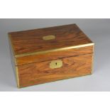 A VICTORIAN WALNUT AND BRASS BOUND WRITING SLOPE, hinged cover opening to reveal ebonised interior