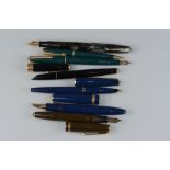 A COLLECTION OF PARKER FOUNTAIN PENS AND A PEN SET, these include a Maxima in a blue and gold, a