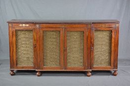 AN EARLY 19TH CENTURY MAHOGANY AND BRASS INLAID BREAKFRONT SIDEBOARD, the frieze with moulded top