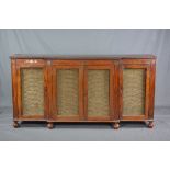 AN EARLY 19TH CENTURY MAHOGANY AND BRASS INLAID BREAKFRONT SIDEBOARD, the frieze with moulded top