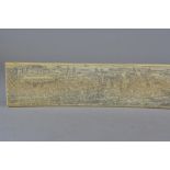 A LATE 19TH CENTURY BONE (PROBABLY A RIB), etched with a panoramic view of Japanese figures in a