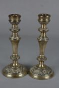 A PAIR OF ELIZABETH II VICTORIAN STYLE SILVER CANDLESTICKS, of circular form with cast rims and