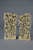 A PAIR OF 19TH CENTURY CHINESE IVORY WRIST RESTS, carved as fruit trees with figures on the ground