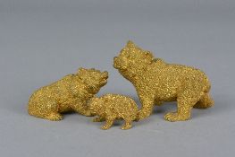 A SET OF THREE GILT BRONZE FIGURES OF BEARS, in different poses and graduated in size, approximate