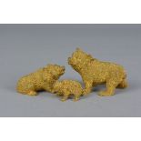 A SET OF THREE GILT BRONZE FIGURES OF BEARS, in different poses and graduated in size, approximate