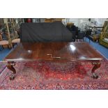 A VICTORIAN MAHOGANY WIND OUT DINING TABLE, of rectangular form, moulded edge with rounded