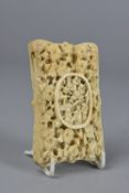 A LATE 19TH CENTURY CHINESE CANTON CARVED IVORY CARD CASE, of wavy rectangular outline, the front