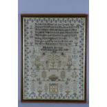 AN EARLY 19TH CENTURY NEEDLEWORK SAMPLER, worked in silks on a linen ground, floral border enclosing