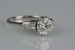 A LATE 20TH CENTURY DIAMOND DRESS RING, white metal claw setting, one diamond, round brilliant