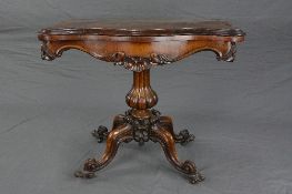 AN EARLY VICTORIAN ROSEWOOD FOLD OVER CARD TABLE, of serpentine outline, the interior with circle of