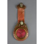 AN EARLY 20TH CENTURY SCHILD & CO GILT METAL AND PINK ENAMEL EIGHT DAY TRAVEL CLOCK, hanging loop