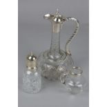 A LATE VICTORIAN CUT GLASS CLARET JUG, of shaft and globe form, plated mounts, rope twist effect