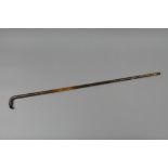 AN ANTIQUE PERCUSSION WALKING STICK SHOTGUN, in 42 bore fitted with a 30' barrel, its body is