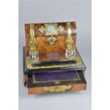 A VICTORIAN BURR WALNUT AND EBONISED BRASS BOUND DESK STAND STATIONARY CABINET, the domed hinged top