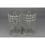 A PAIR OF VICTORIAN CLEAR GLASS LUSTRES, each suspended with fifteen droppers in two lengths, (three