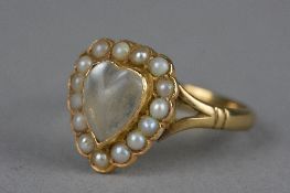 A LATE VICTORIAN MOONSTONE AND SEED PEARL HEART RING, a heart shaped cabochon moonstone contained