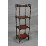 A MID VICTORIAN ROSEWOOD FOUR TIER WHAT-NOT, of wavy rectangular form, the top tier with spindle