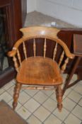 AN EARLY 20TH CENTURY ASH SPINDLE BACK SMOKERS CHAIR