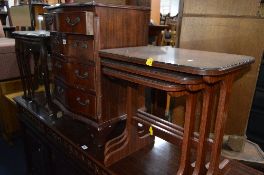 A MAHOGANY NEST OF THREE TABLES, and another mahogany nest of three tables and a modern mahogany