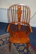 A 17TH CENTURY OAK SPINDLE BACK WINDSOR ARMCHAIR, with splat back, on tutrned legs united by a