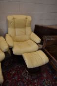 AN EKORNES STRESSLESS CREAM/YELLOW RECLINING SWIVEL CHAIR, and a matching footstool