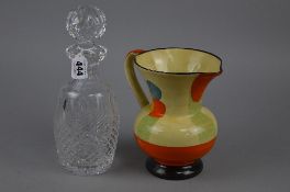 A CUT GLASS DECANTER AND A WADE HEATH DECO STYLE JUG (2)