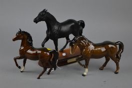 THREE ROYAL DOULTON AND BESWICK HORSES, to include 'Spirit of Fire' DA59B black, matt, Palomino