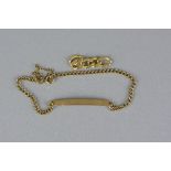 A MID-LATE 20TH CENTURY 9CT GOLD IDENTITY BRACELET, a narrow curved identity panel fitted to a plain