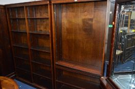 A MODERN MAHOGANY DOUBLE OPEN BOOKCASE, with adjustable shelving and a similar single open