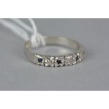 A LATE 20TH CENTURY 9CT WHITE GOLD SAPPHIRE AND DIAMOND HALF ETERNITY RING, ring size N1/2,