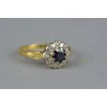 AN 18CT GOLD SAPPHIRE AND DIAMOND ROUND CLUSTER RING, estimated total diamond weight approximately