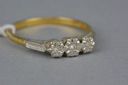 A LATE 20TH CENTURY 18CT GOLD THREE STONE DIAMOND RING, eight cut diamonds illusion set, estimated
