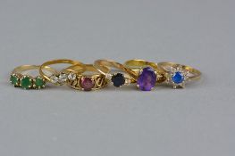 A COLLECTION OF DRESS RINGS, to include a mid to late 20th Century 9ct gold three stone emerald