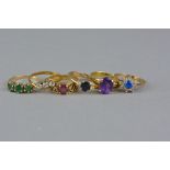 A COLLECTION OF DRESS RINGS, to include a mid to late 20th Century 9ct gold three stone emerald