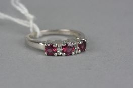 A GARNET AND ZUBIC ZIRCONIA RING, ring size N1/2, stamped '925'