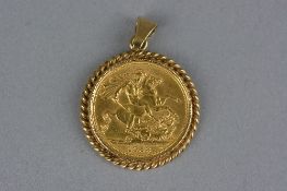 A 1958 SOVEREIGN IN A 9CT MOUNT, approximate weight 12 grams