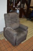 A PRIDE UPHOLSTERED ELECTRIC RISE AND RECLINE ARMCHAIR, (receipt of purchase and manual included)
