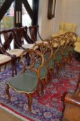 A SET OF SIX VICTORIAN CARVED WALNUT DINING CHAIRS, with foliate and scrolled splat back on cabriole