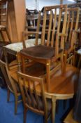 A WILLIAM LAWRENCE TEAK TABLE, six chairs and two bookcases (opposite) (9)