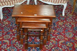 AN OLD CHARM OAK NEST OF THREE TABLES