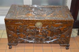 A CARVED CAMPHOR WOOD BLANKET CHEST, with a internal tray